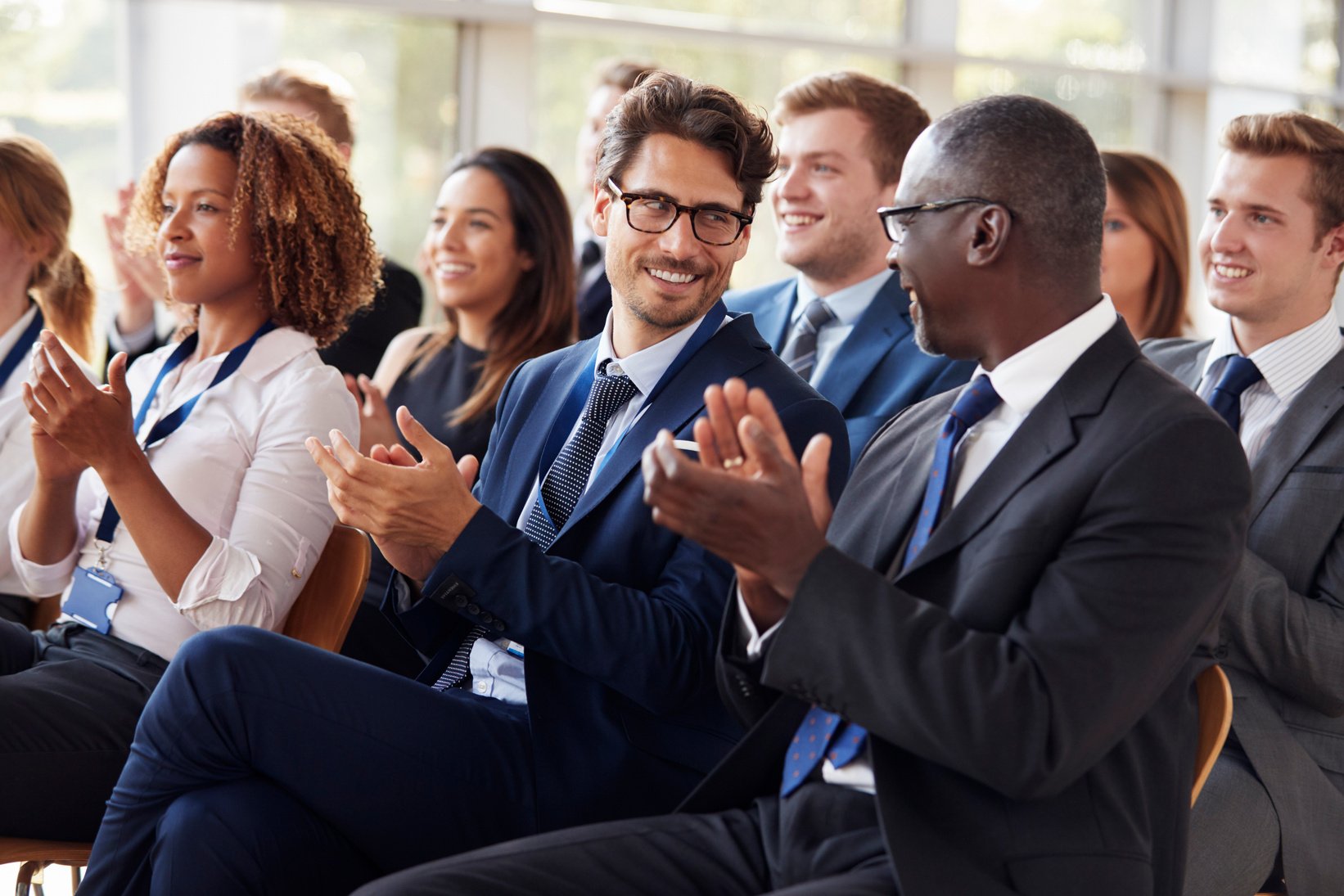 Audience Clapping at Business Seminar